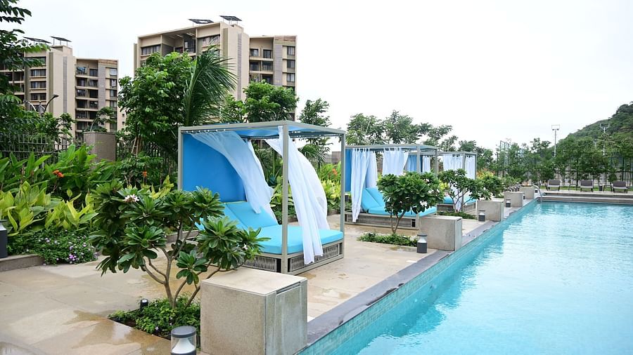 image featuring the sun loungers with curtains at club charholi, pune