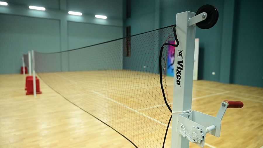 close up image of the badminton net placed in the badminton court at club charholi, pune