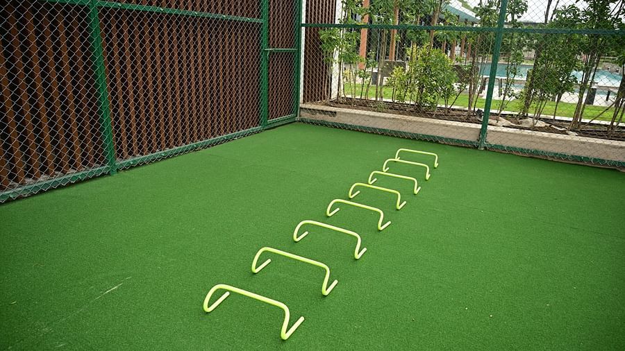 image of the hurdles lined up on a fake grass tarmac at club charholi, Pune