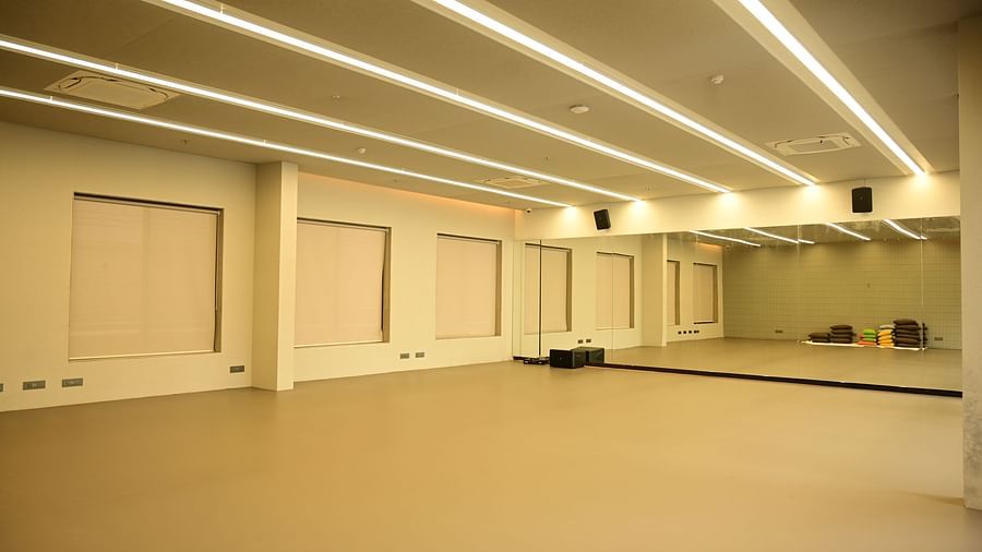 a spacious huge area with mirrored wall at the far end at our club in pune | club charholi, pune