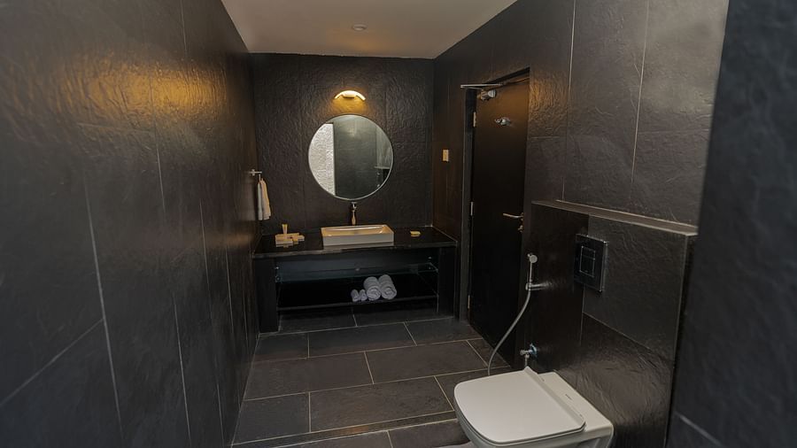 image of a luxurious bathroom with black tiles at the family villa two bedroom - Darza Resorts