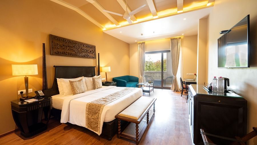 Premium bed room at Essentia Luxury Resort & Spa, Udaipur with modern room amenities and a balcony