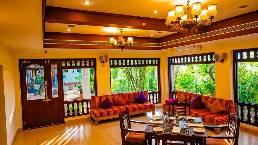 Restaurant dining area with a view of the lush surroundings.