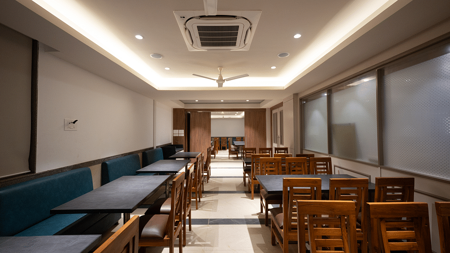 A restaurant interior with comfortable seating and a contemporary design at Lotus Leaf Boutique Hotel.
