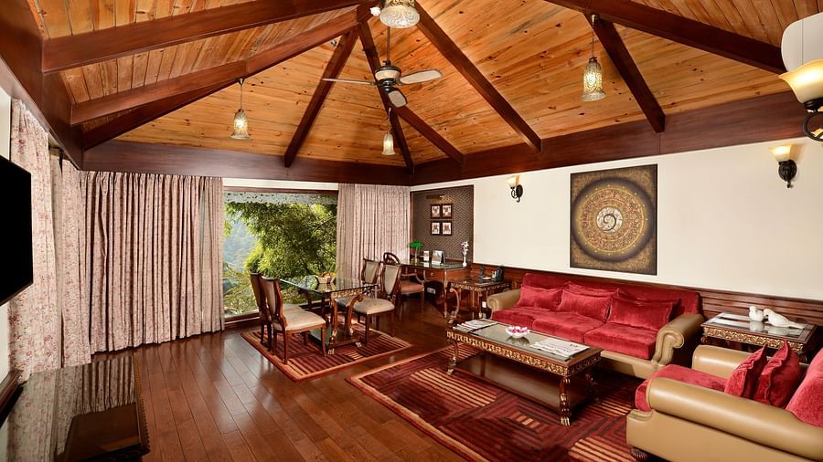 the living area with a TV and sofa sets - Mayfair Spa Resort & Casino Gangtok 