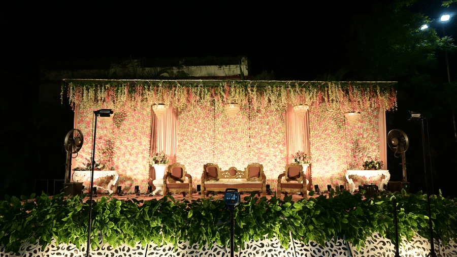 Beautifully decorated stage setup at Fiesta Lawn, Papaya Tree Hotels, designed for evening events and wedding celebrations.
