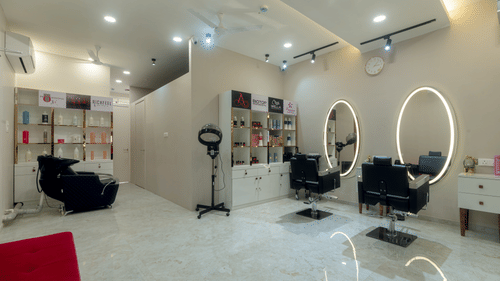 Overview of the Salon with chairs and mirrors in view - VITS Satyajeet Karad