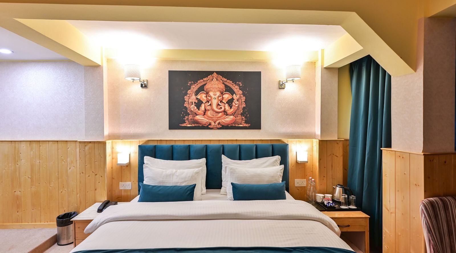Deluxe Room with spacious bed, wooden furniture and warm lighitng at Avianna Seven Seas, Darjeeling10