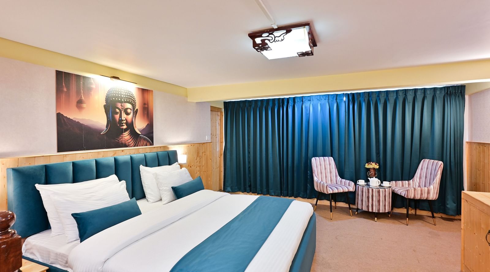 Premium room featuring a king sized bed, wall mounted television, windows with curtains, and warm lighting at Avianna Seven Seas, Darjeeling14