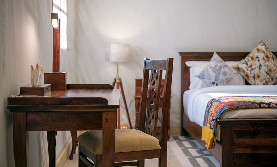 alt-text The work desk and chair placed close to the bed - Karwaan Jaisalmer