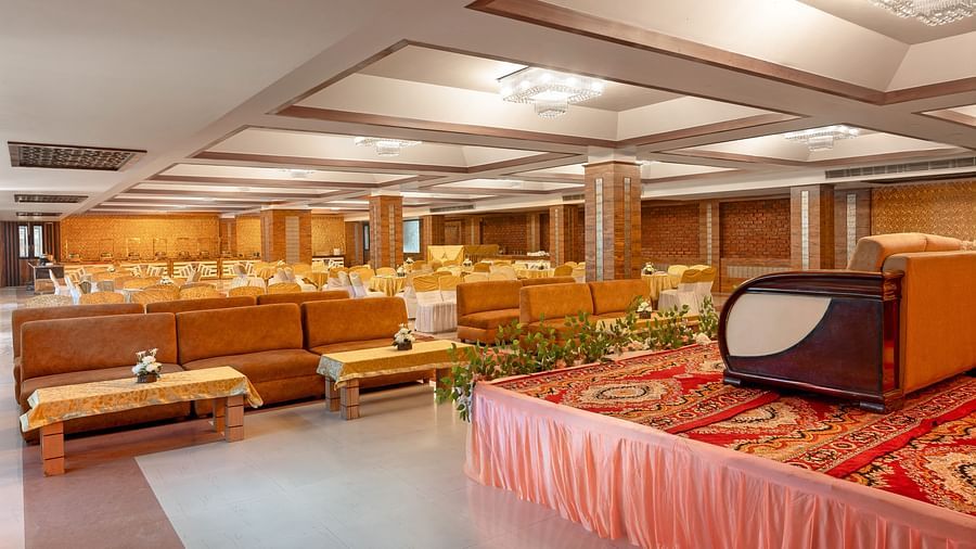 An elegant banquet hall featuring plush seating arrangements, designed for events and celebrations - Clarks Inn Express, Near Jammu Bari Brahmana Railway Station