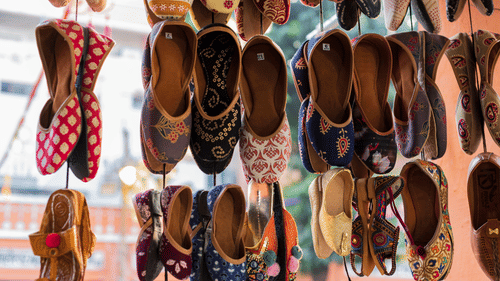 Vibrant traditional Indian juttis on display, showcasing cultural heritage in Jaipur.