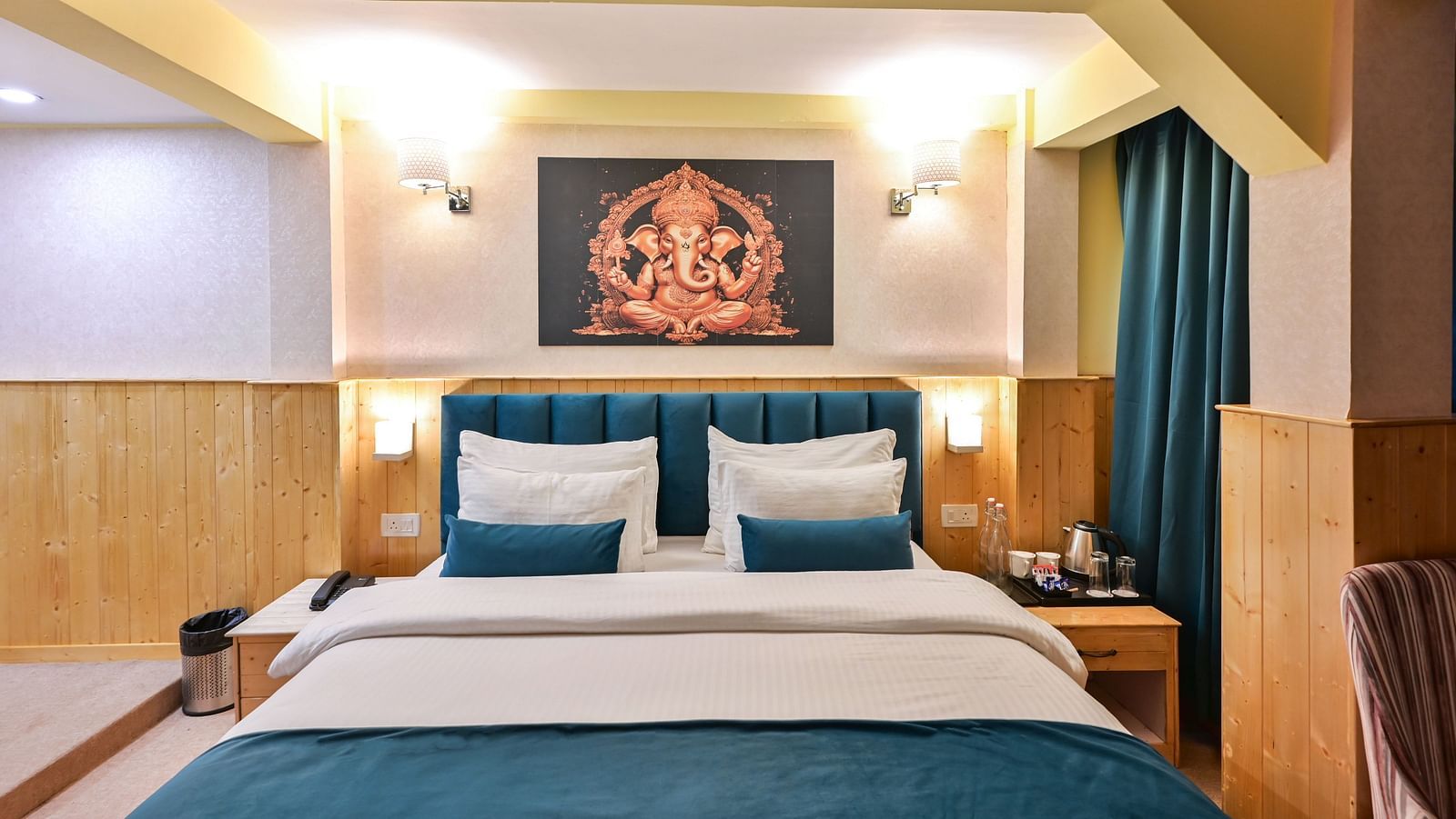 Deluxe Room with spacious bed, wooden furniture and warm lighitng at Avianna Seven Seas, Darjeeling10