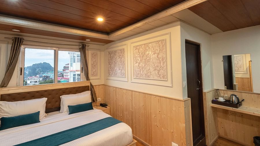an image of a premium room with balcony featuring a tea and a coffee maker placed on the table at Avianna New Mandala Hotel & Spa, Darjeeling