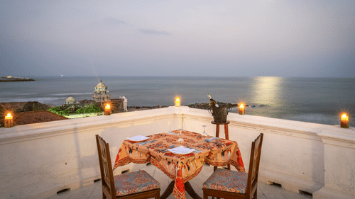 Step across to Neemrana's Bungalow on the Beach, Tranquebar, where your table is set against the timeless rhythm of the sea.