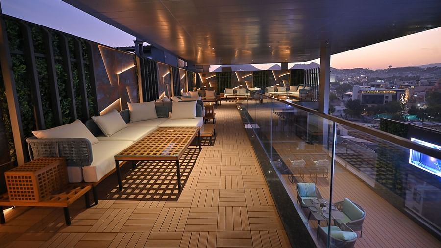 A rooftop setup with chairs neatly arranged for an event at Clarks Collection Grand Sapphire, Ajmer.