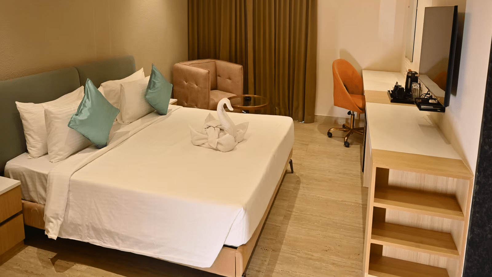 Spacious premium room with a comfy bed, a cosy seating area, and a work desk with a chair - Livancia Hillside