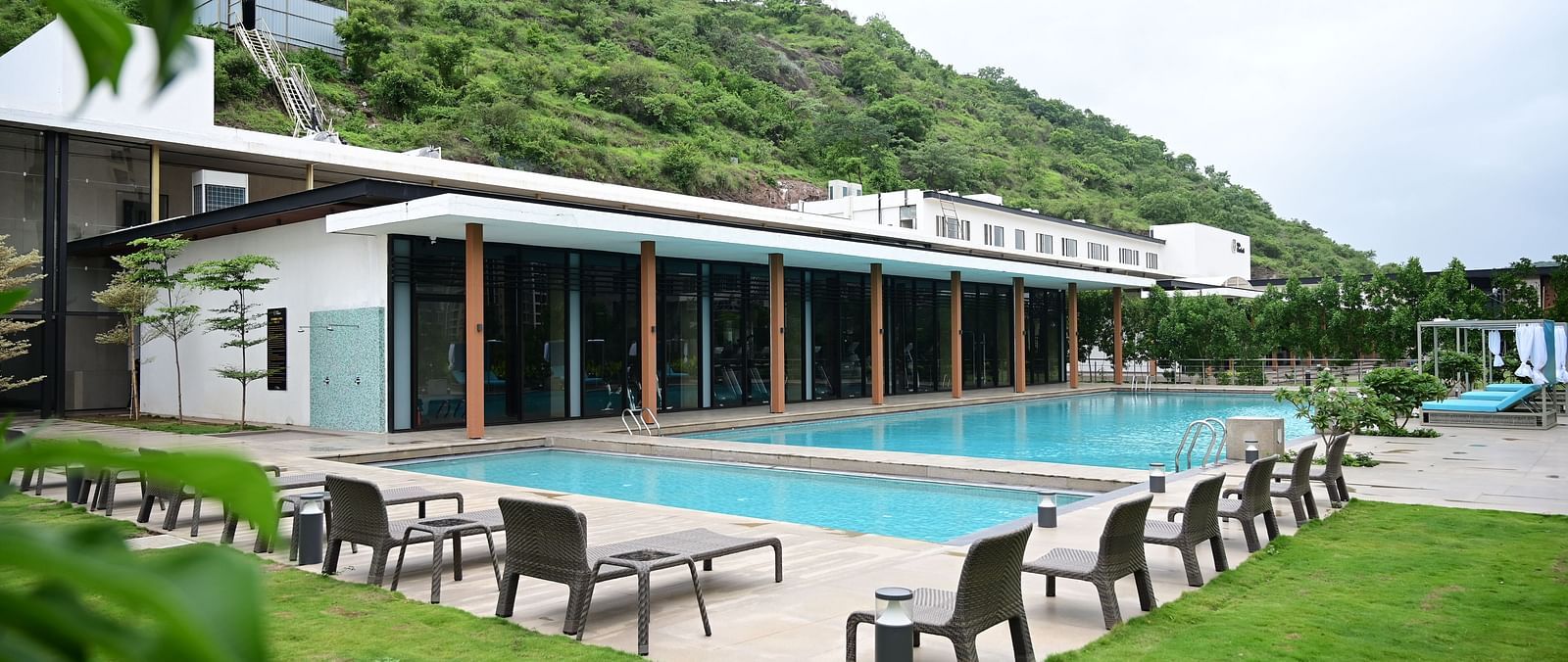 swimming pool at club charholi after the green lawn
