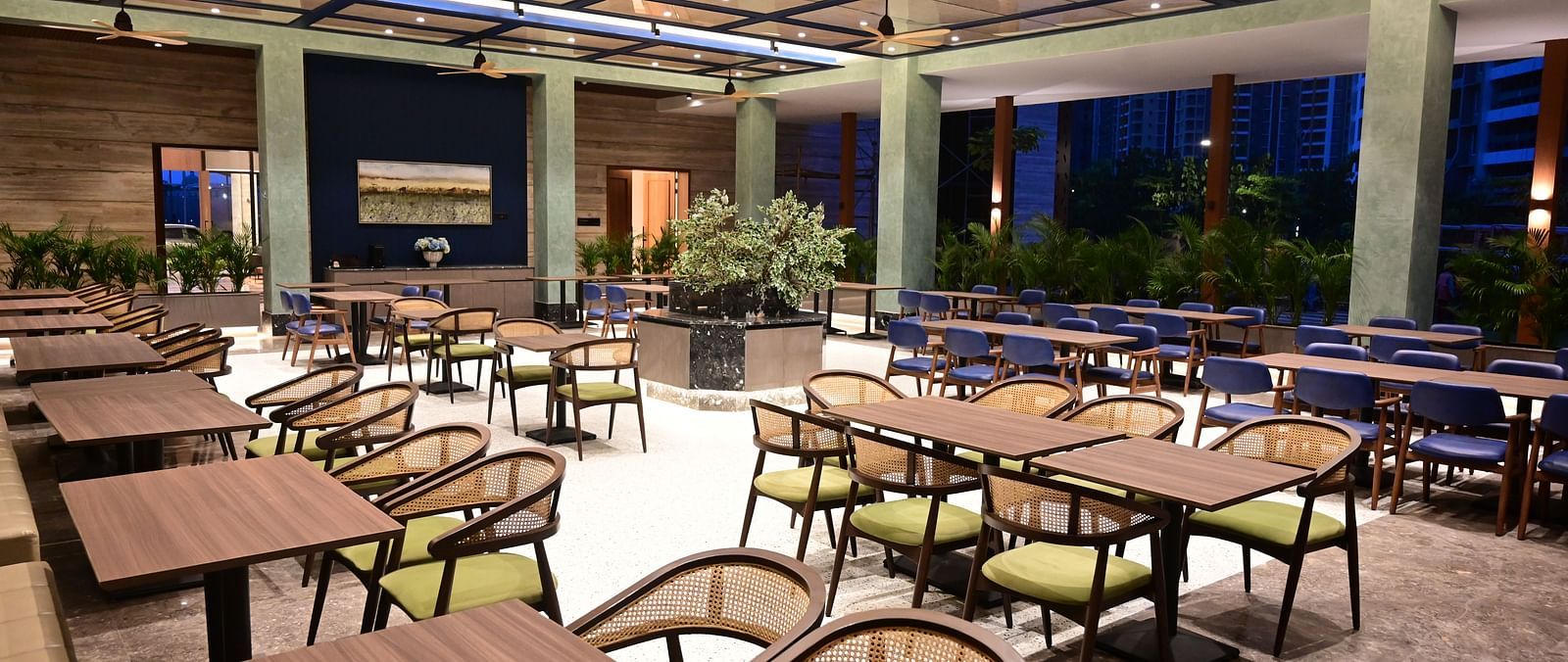 close up images of the tables at citrus restaurant and cafe at club charholi, pune at late evening