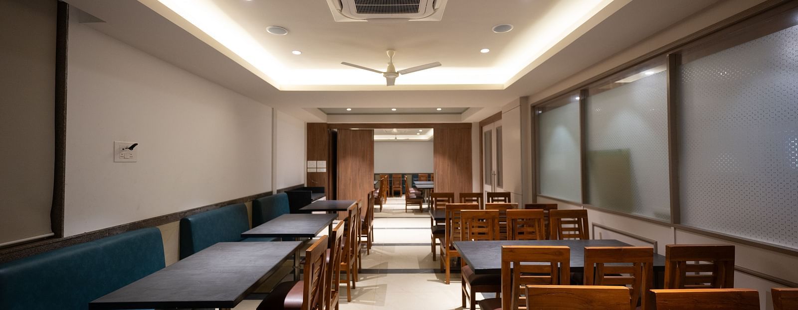 A restaurant interior with comfortable seating and a contemporary design at Lotus Leaf Boutique Hotel.