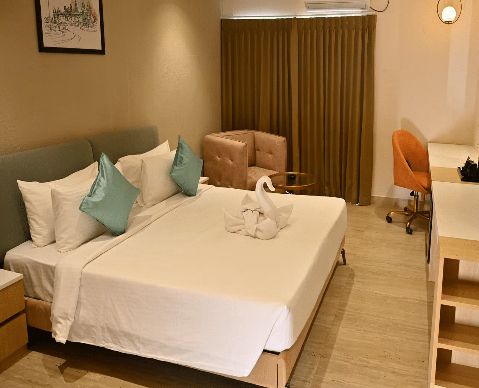 Spacious premium room with a comfy bed, a cosy seating area, and a work desk with a chair - Livancia Hillside