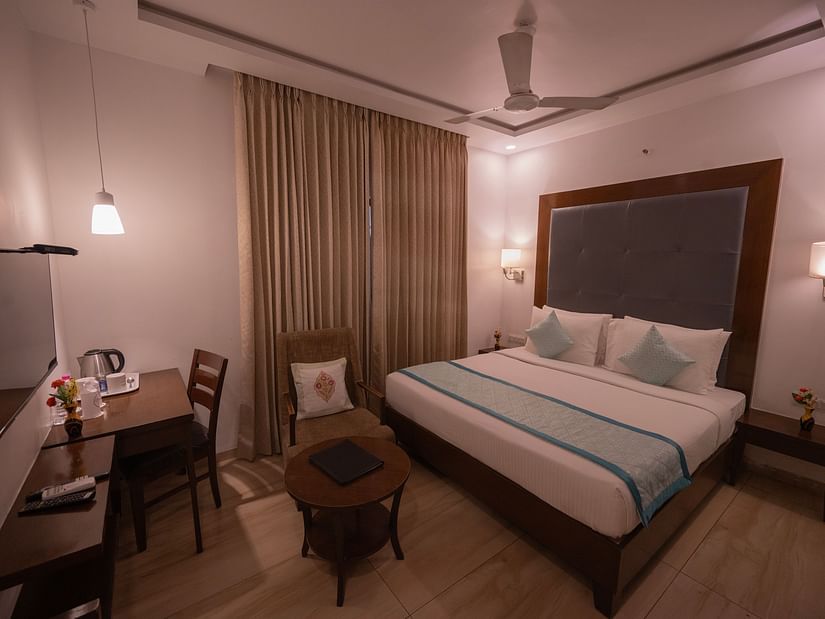 Clarks Collection Bhavnagar bedroom with desk, chair, and lamp.