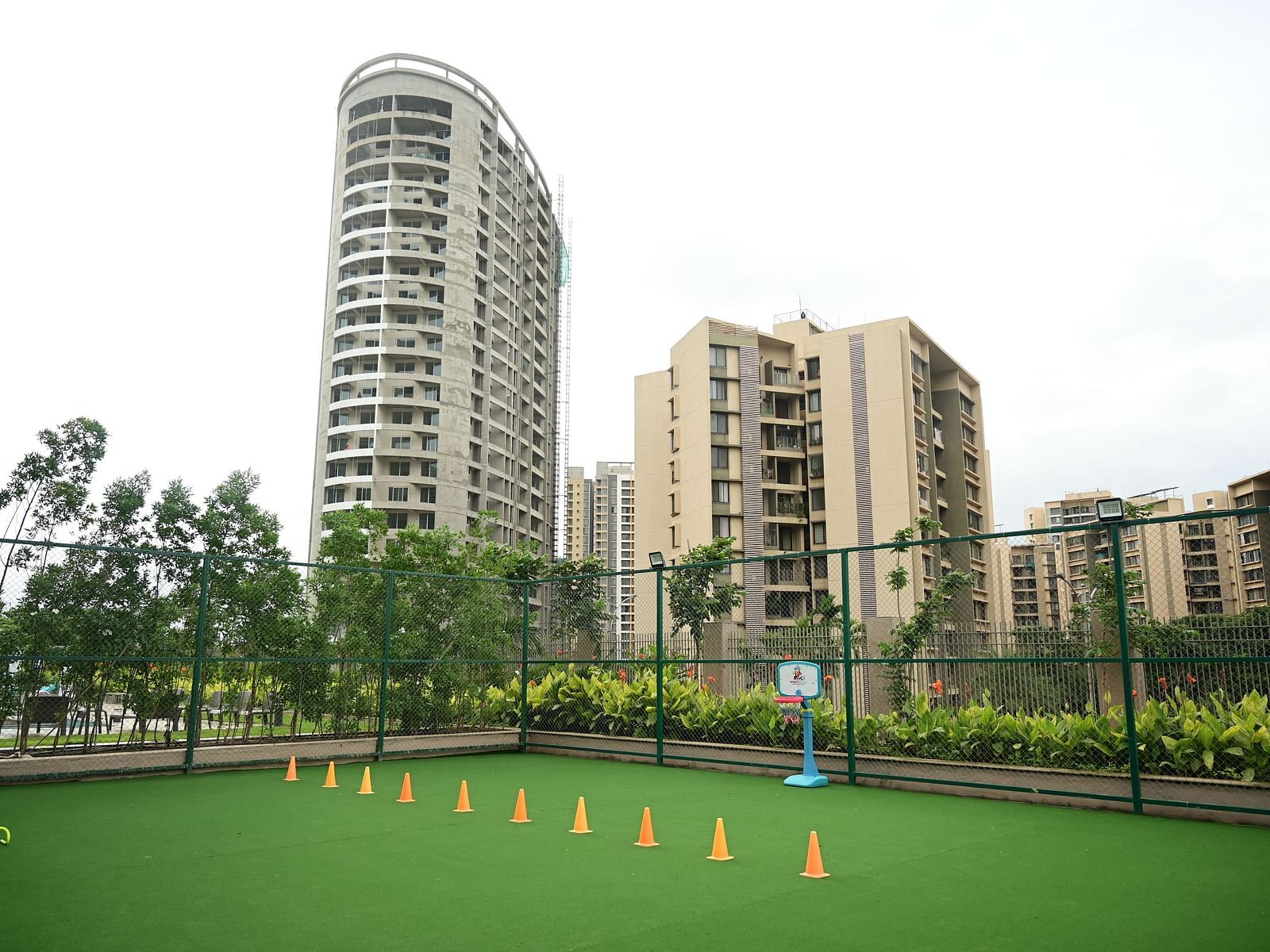 image of various cones lined up in the outdoor play area for kids at club charholi, pune