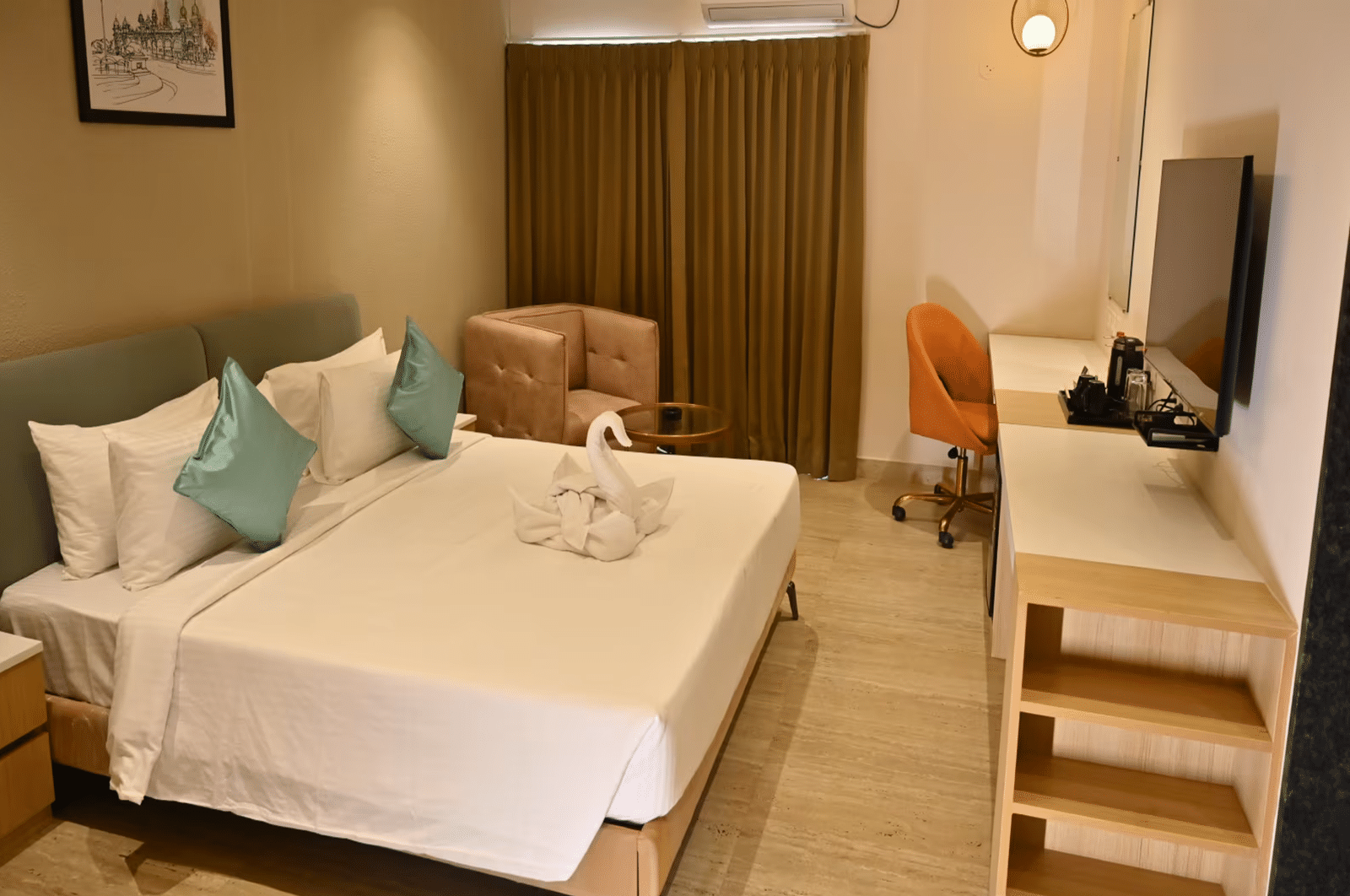 Spacious premium room with a comfy bed, a cosy seating area, and a work desk with a chair - Livancia Hillside