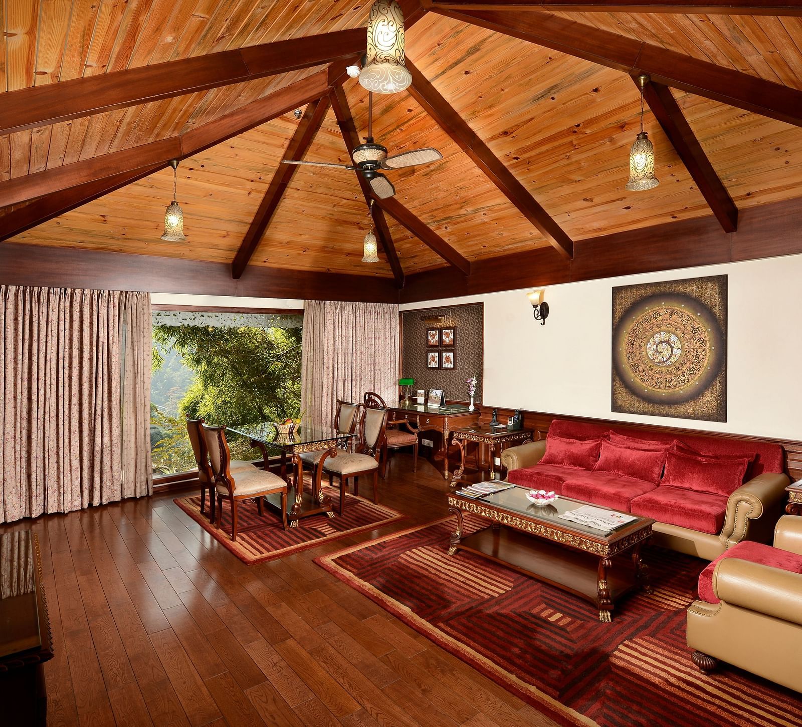 the living area with a TV and sofa sets - Mayfair Spa Resort & Casino Gangtok 