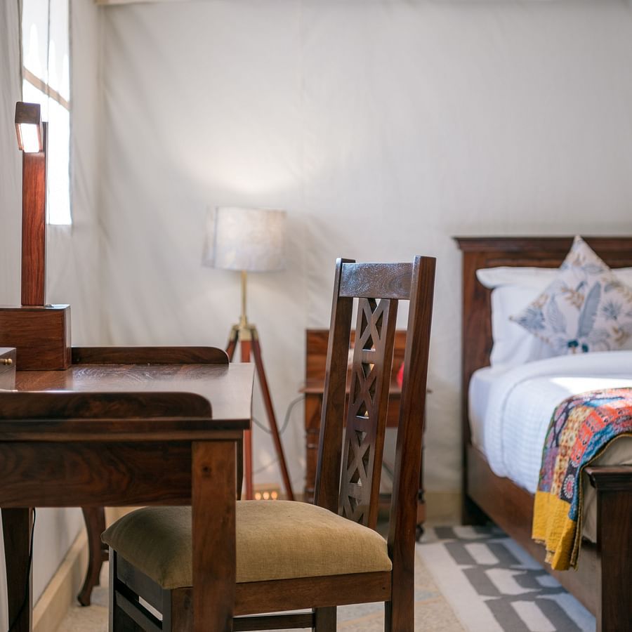 The work desk and chair placed close to the bed - Karwaan Jaisalmer