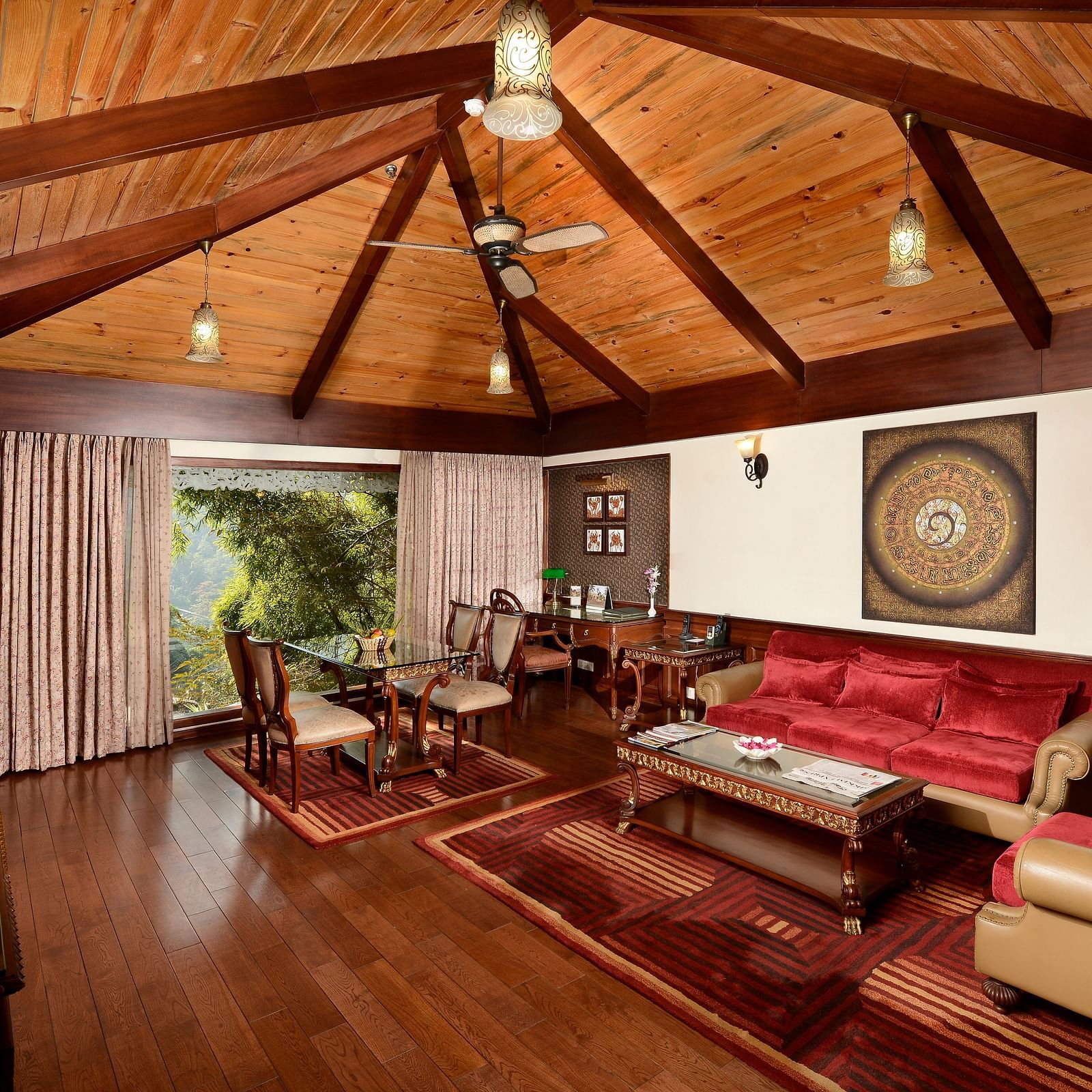 the living area with a TV and sofa sets - Mayfair Spa Resort & Casino Gangtok 