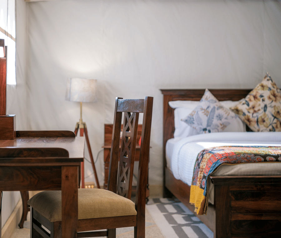 The work desk and chair placed close to the bed - Karwaan Jaisalmer