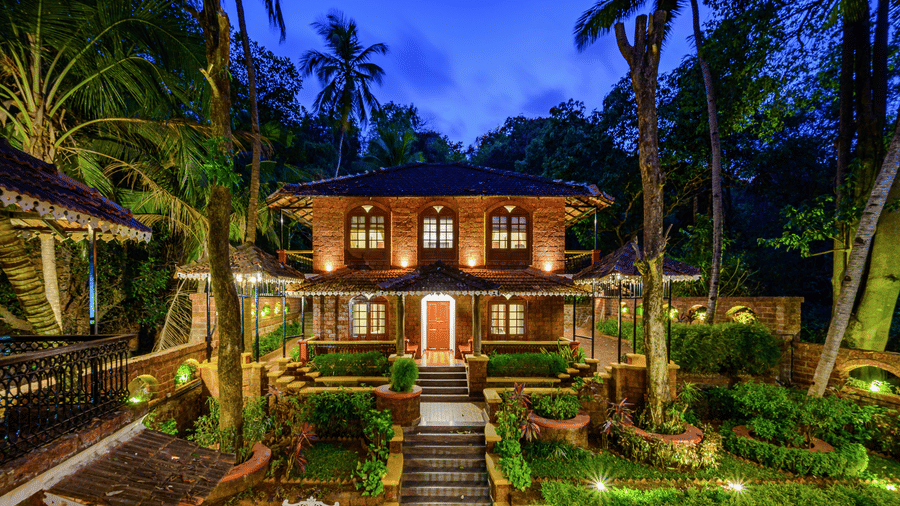 Neemrana’s Three Waters - 20th century, Betul, South Goa's facade under a dark sky.