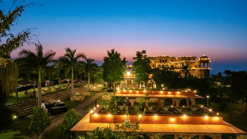 Night view of Tijara Fort-Palace - 19th Century, Alwar, with a beautifully hued sky in the background.