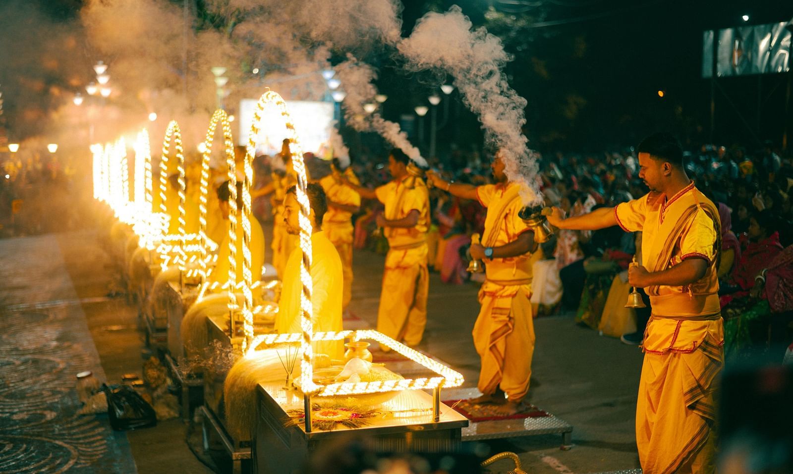 An image of evening prayer with priest holding incense in their hands