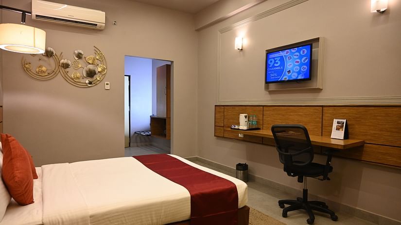 Hotel room with workspace and tv setup