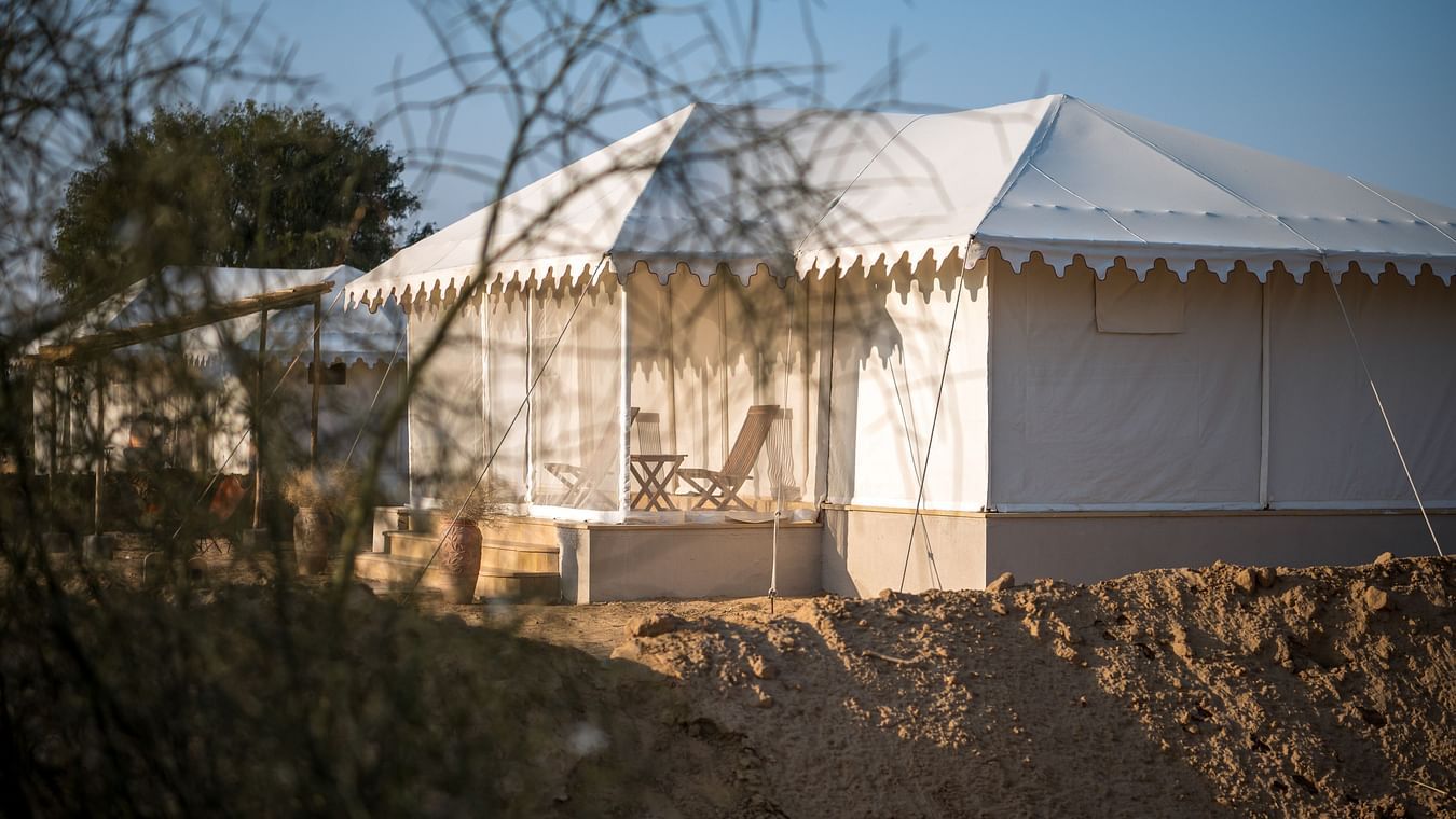 The exterior of the cottage with desert plants in the foreground - Karwaan Jaisalmer