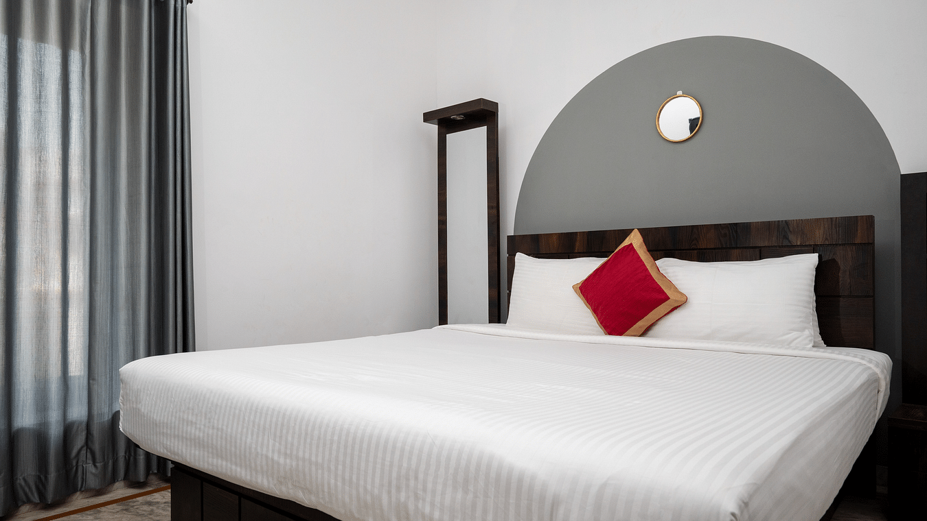 A bed with white linens - Richmonde Ananta Elite, Goa