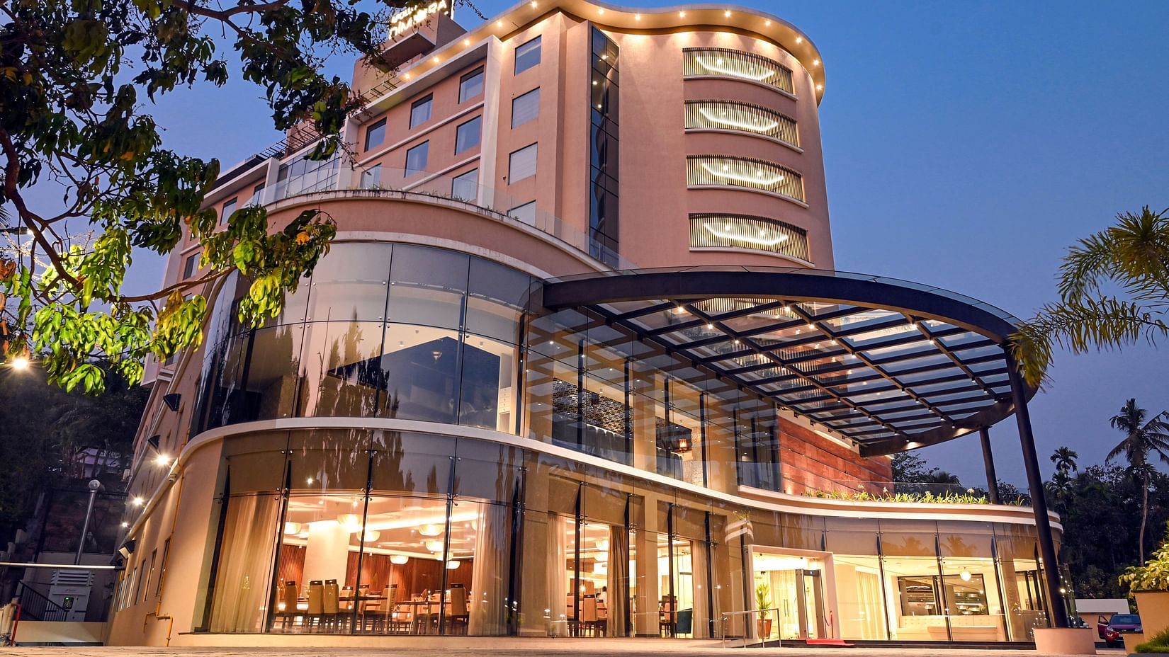 facade of the exterior of Dimora hotel in Calicut