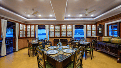 Wooden seating arrangements in Sea House Resturant Neemrana s Three waters