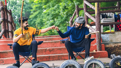 two guys fist pumping and fishing in the Fish Pond - Black Thunder, Coimbatore