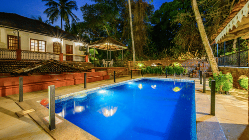 a swimming pool with a building on the side