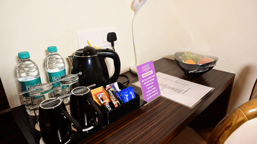 a study table with refreshments on top of it inside one of the rooms at VITS shanti solitaire, North Goa