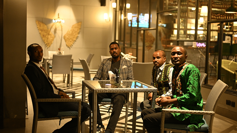 people at a restaurant table posing for a photo - Hotel Polo Towers, Agartala