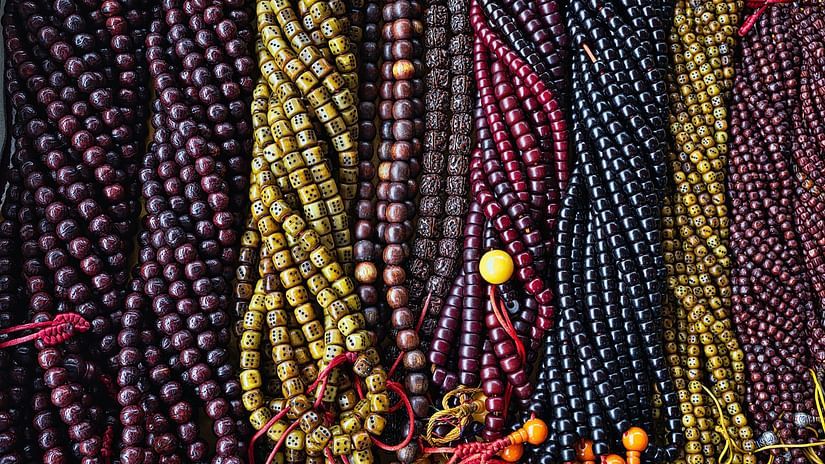A bunch of prayer beads made of numerous colourful beads of varying lengths