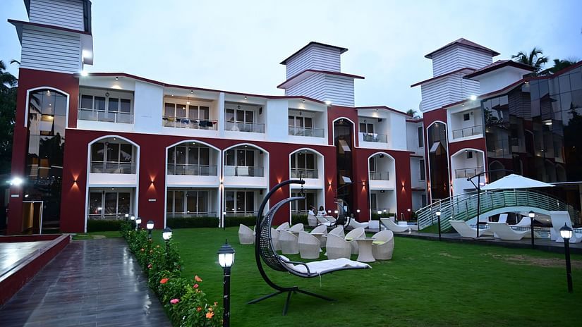 facade view of VITS shanti solitaire, North Goa with the garden view and seating arrangements on it