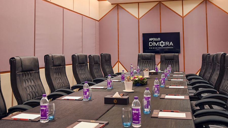  black coloured seats and a large table offered at the boardroom  1
