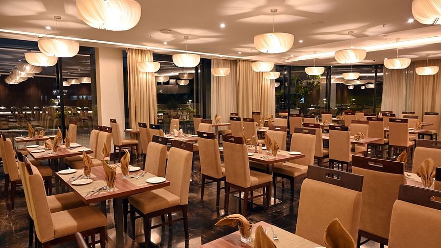 sitting area at the multi-cuisine restaurant in Calicut at Hive 5