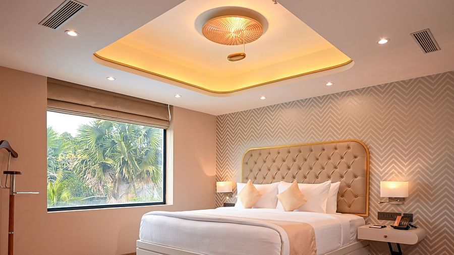 the bed at Superior Rooms in Kozhikode