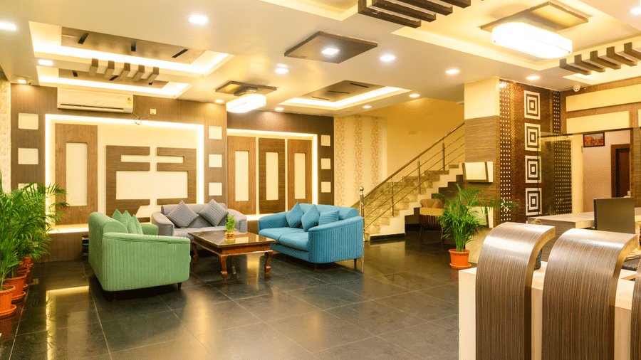 Hotel lobby entrance featuring sofa seating and stylish interior design at Biznotel by Pride, Deoghar